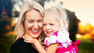 Founder of Apex Social Group, Susan Asay, with her little daughter