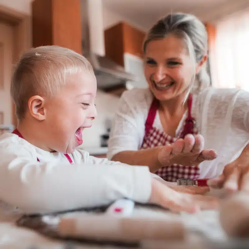 A mother and special needs child baking